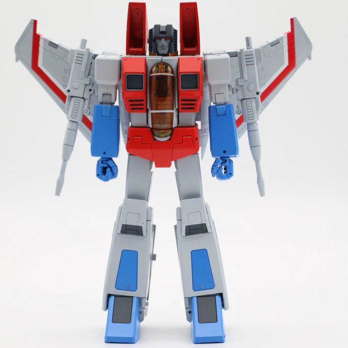 A toy robot figure with a red and gray body, blue accents, and wing-like side panels, photographed against a plain light background.