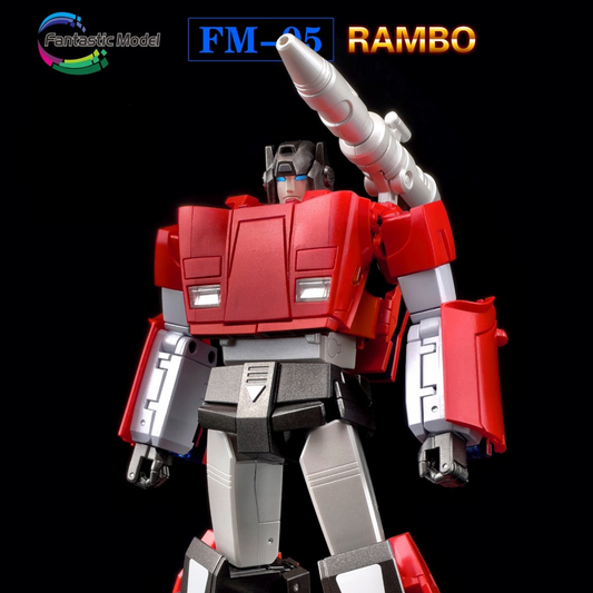 A red, gray, and black toy robot figure resembling Rambo, posed against a solid black background. The figure has a large silver horn on its shoulder and text overlays at the top reading 'FM-05 RAMBO' with a 'Fantastic Model' logo.