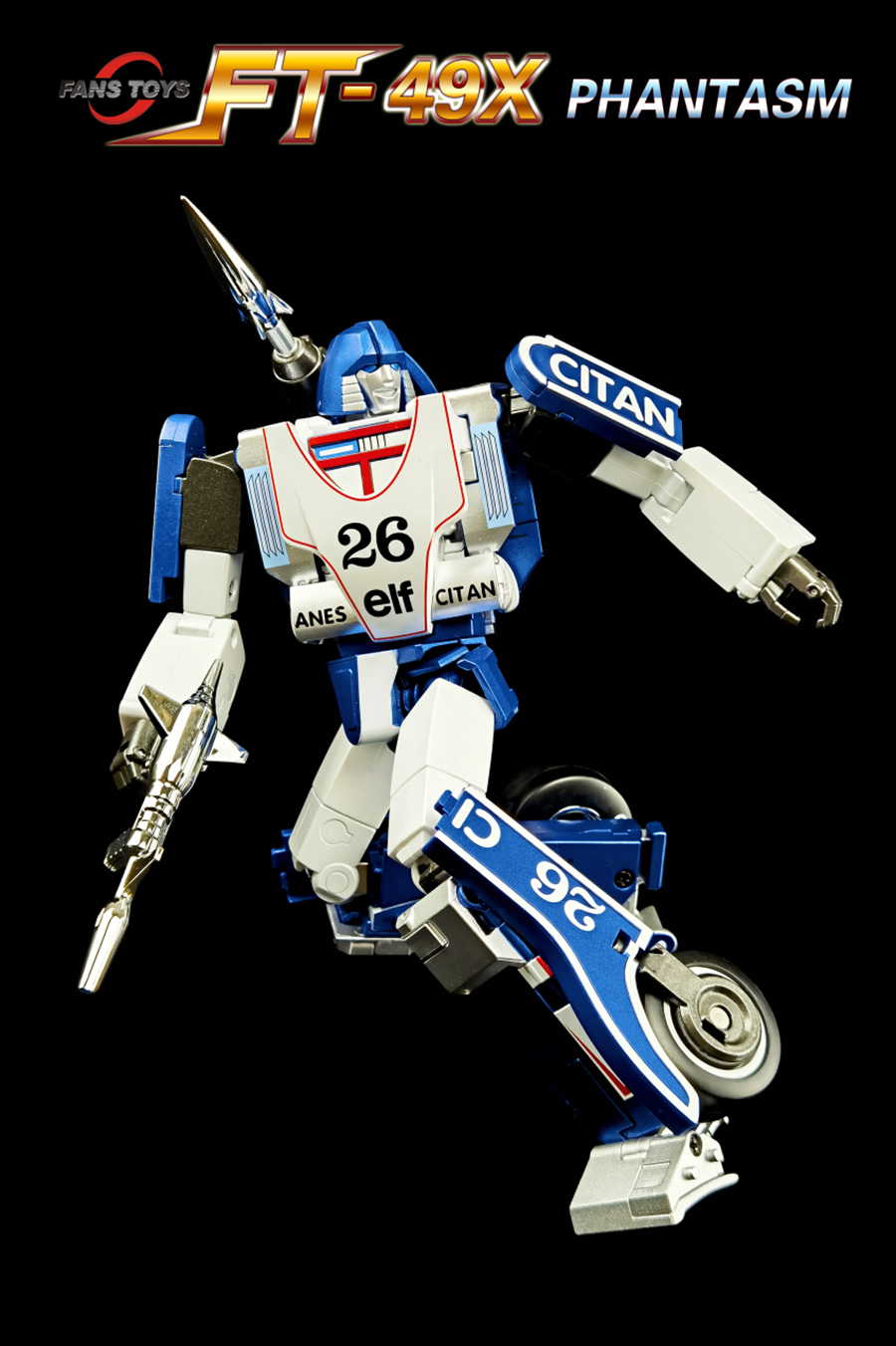 A blue, white, and silver toy robot figure resembling a motorcycle racer, posed dynamically against a solid black background. The top of the image features a logo banner reading 'FT-49X PHANTASM' with 'PANS TOYS' on the left.