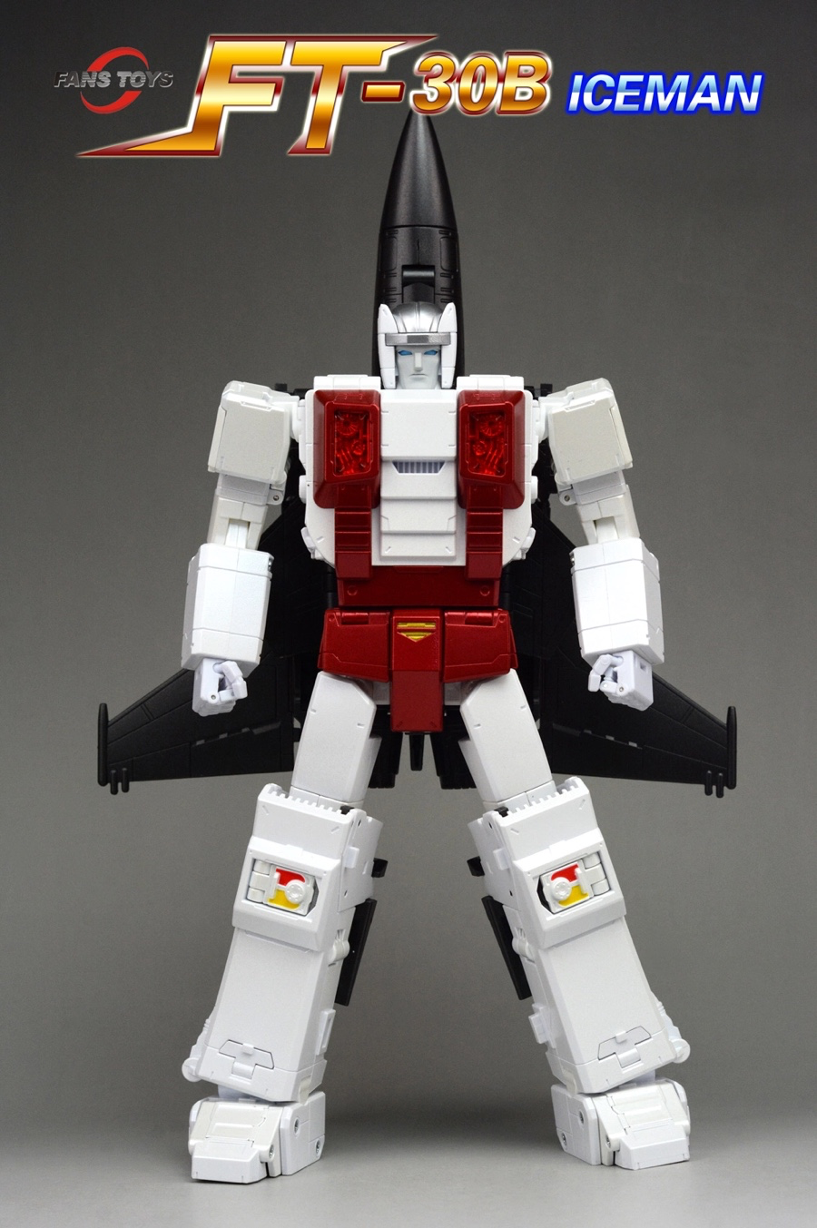 A Transformers-style robot toy figure labeled FT-30B ICEMAN, shown standing against a gray studio background. The figure is primarily white with large red chest panels and black wings/upper body sections.