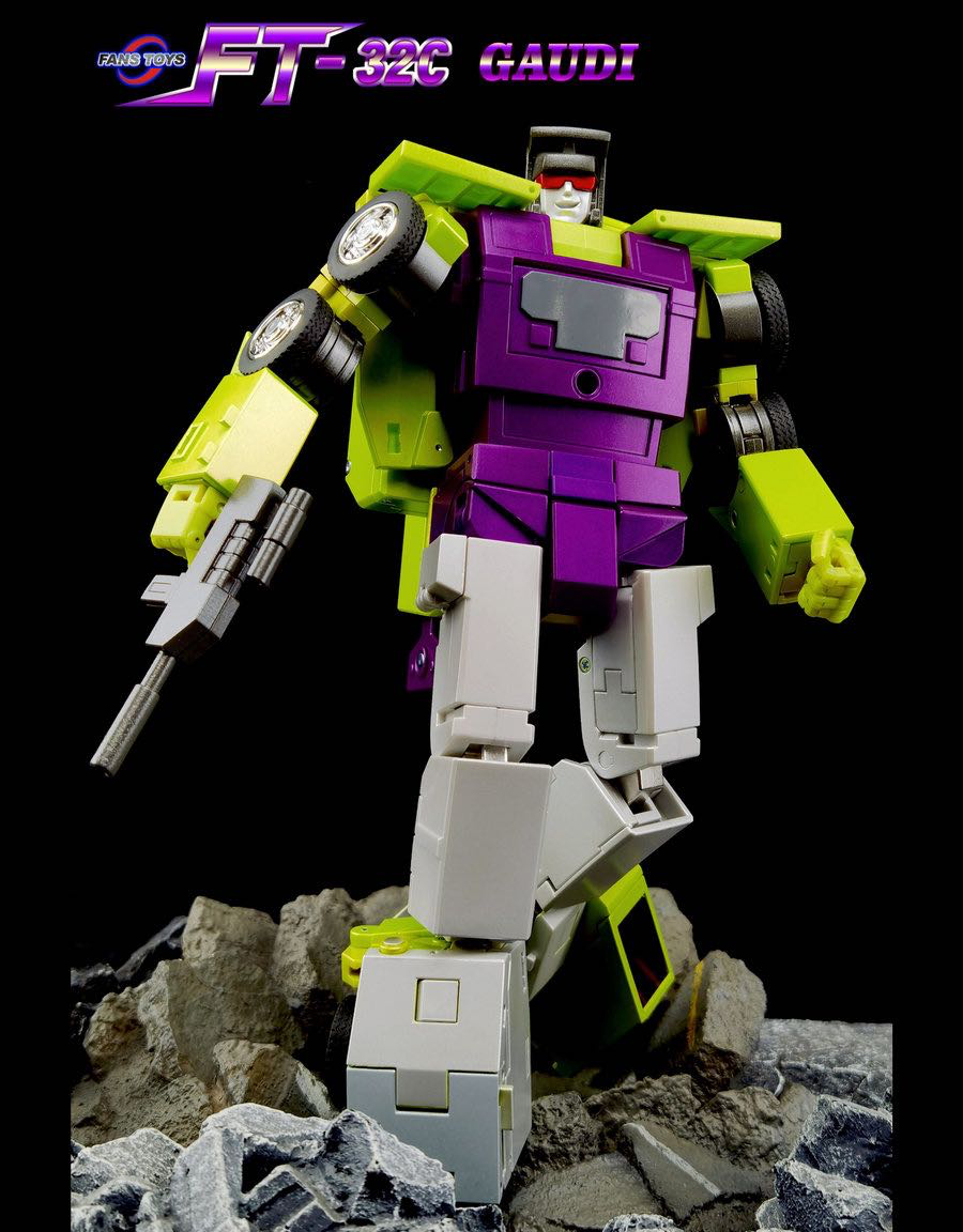 A Transformers-style robot action figure in a dynamic pose, standing on rocky debris against a black background. The figure has a purple chest, bright yellow-green arms and lower body, and light gray legs and weapon.