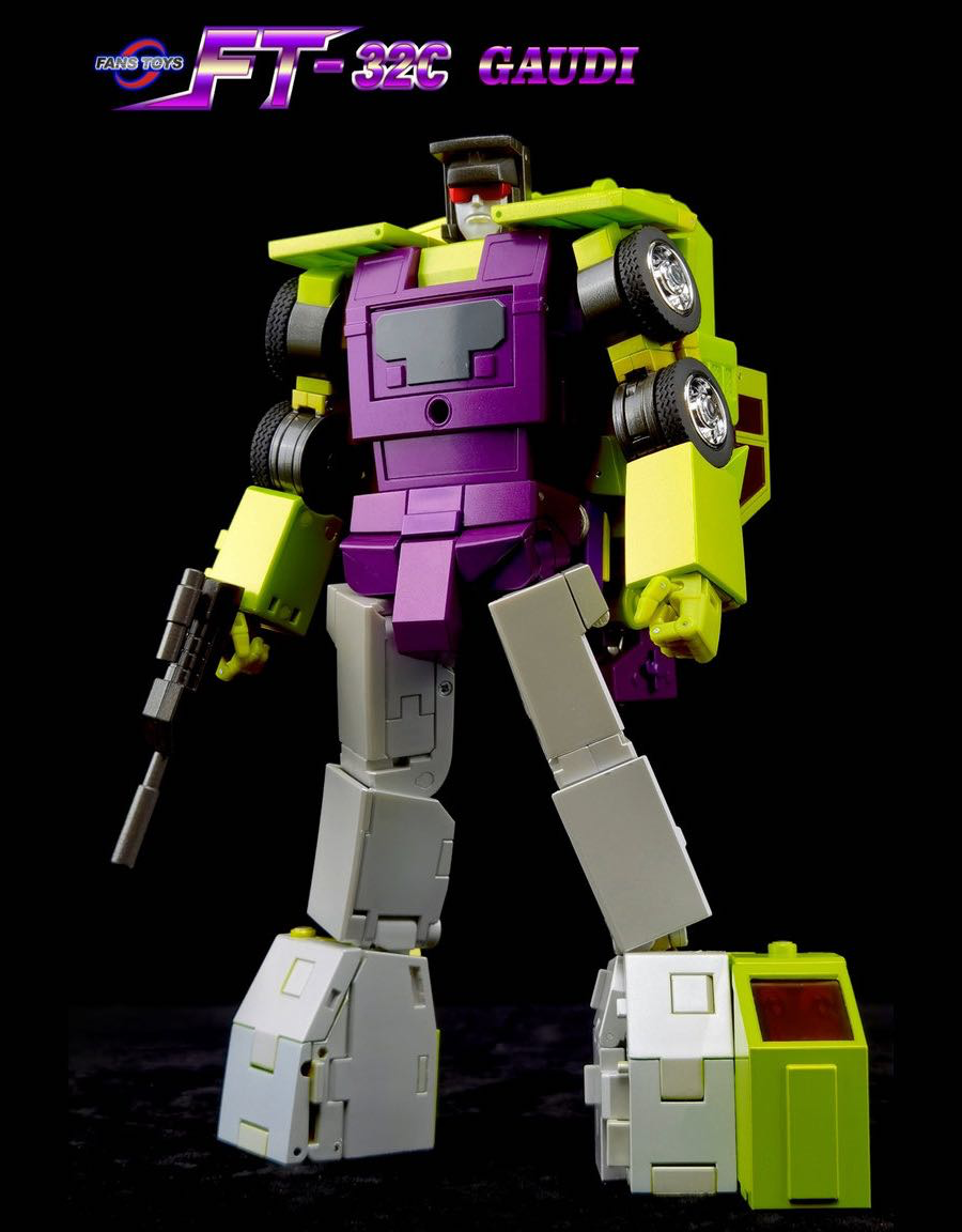 A toy robot figure in a dynamic pose on a black background, with the text 'FT-326 GAUDI' and 'GAUDI TOY' at the top. The figure has a purple torso, lime green shoulders and lower legs, and light gray legs and wheels.