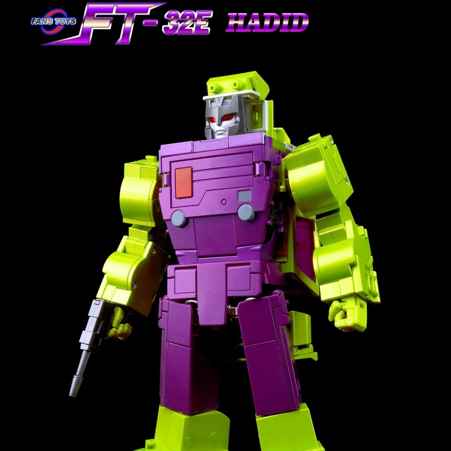A Transformers-style robot action figure or model toy standing against a black background, with a purple torso and limbs and bright yellow-green shoulders, hands, and legs. A small silver-gray head and a gray weapon are visible.