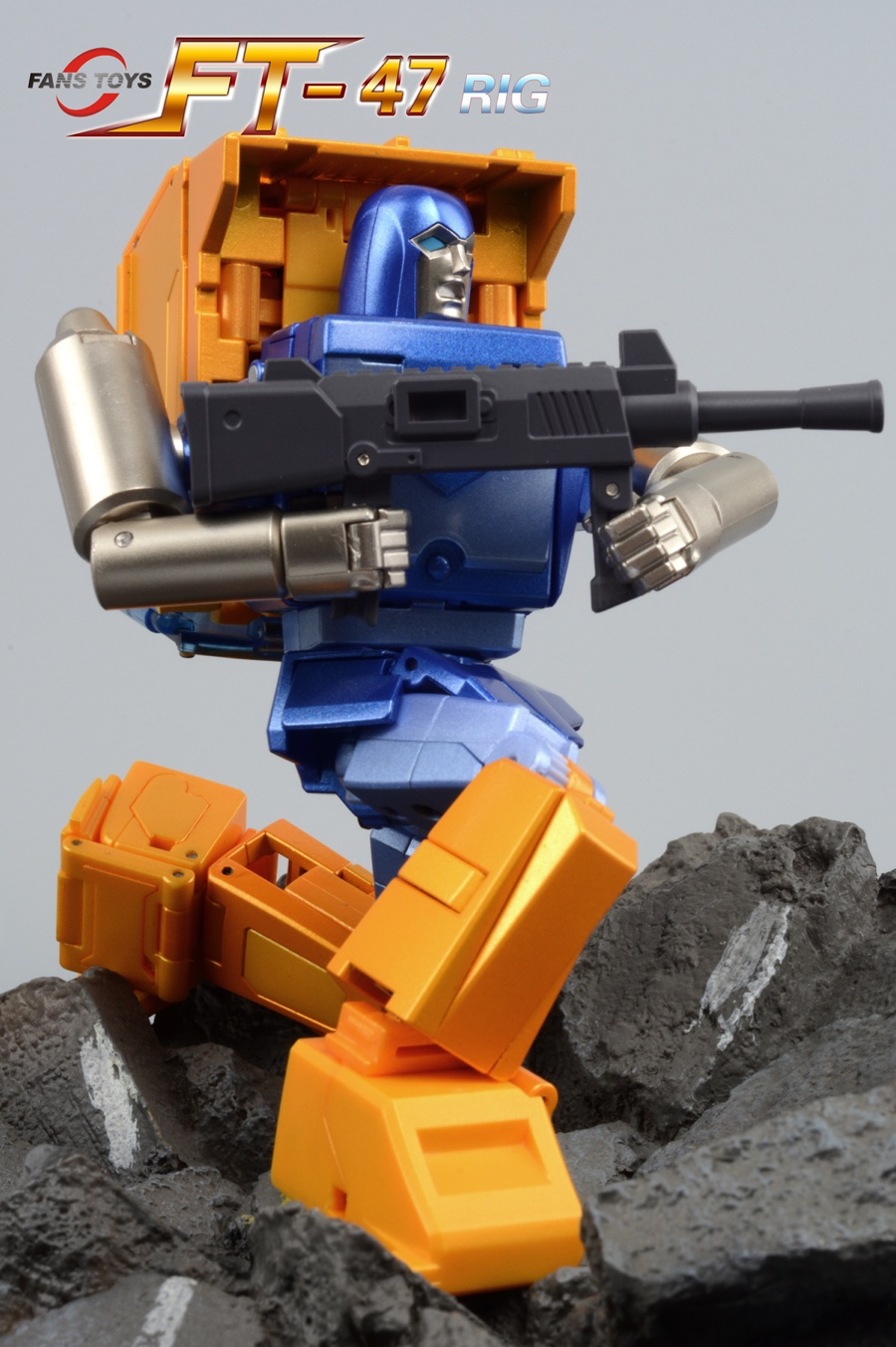 Toy robot with orange and blue design on a gray background