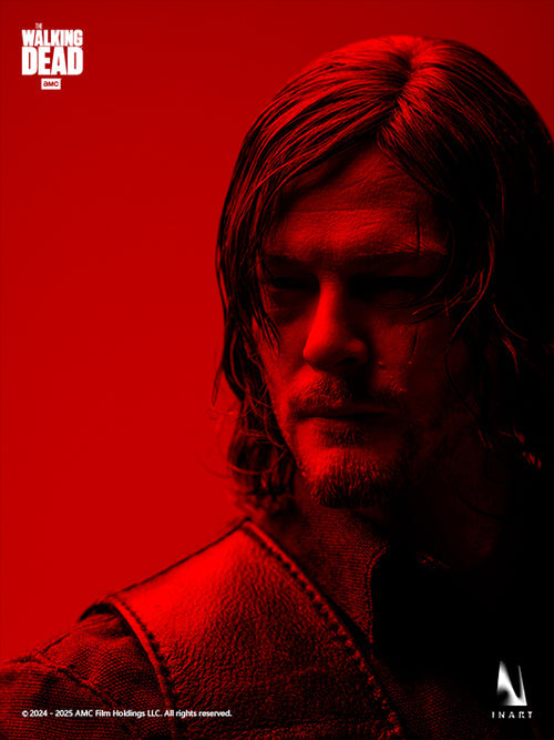A dramatic close-up portrait of a man with long hair and a beard, lit in red tones against a solid red background. The image includes The Walking Dead and Enart branding.