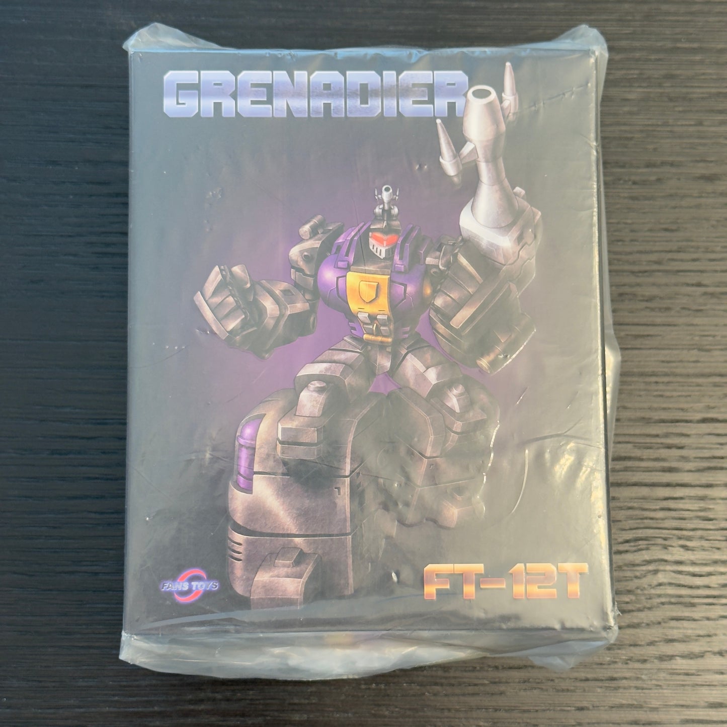 Factory sealed Fans Toys FT-12T Grenadier Purple Masterpiece Bombshell 2021 reissue box in original packaging, never opened or displayed, collector-grade Transformers Insecticon figure MISB.