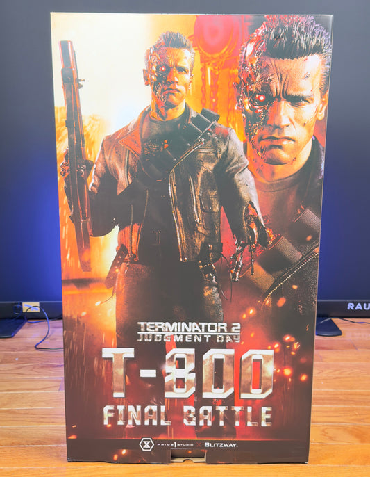 Prime 1 Studio T-800 Battle Damaged DX Bonus Edition 1/3 Scale Statue from Terminator 2: Judgment Day, featuring a highly detailed battle-damaged Arnold Schwarzenegger likeness, exposed endoskeleton parts, LED light-up effects, leather outfit, and detailed futuristic base.  