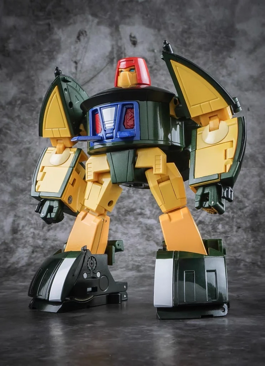 A toy robot figure with a yellow and dark green body, blue chest details, and a red top, posed against a textured gray studio background.